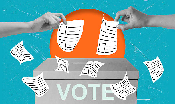 Citizens engage in the voting process by submitting ballots into a ballot box during an election event in a vibrant setting