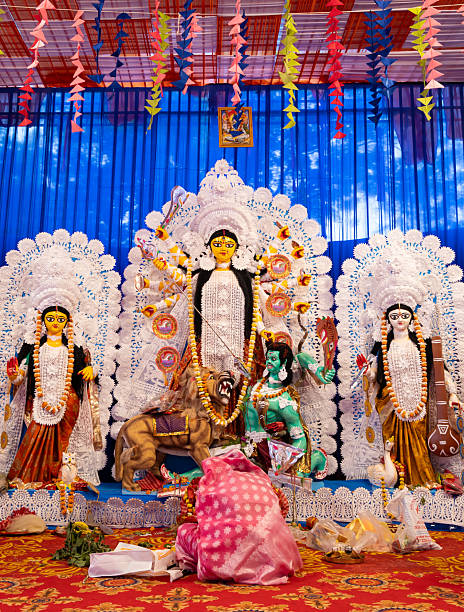 istock goddess durga statue with worshipper offering prayers during dussehra in daylight 2229938701