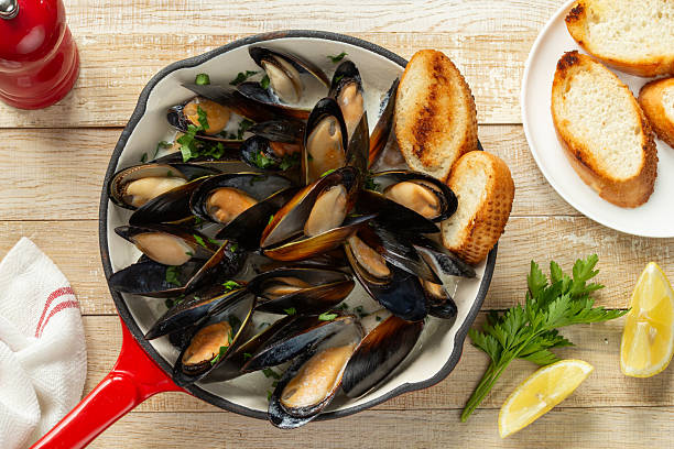 istock cooked mussels with creamy garlic sauce 2229942288