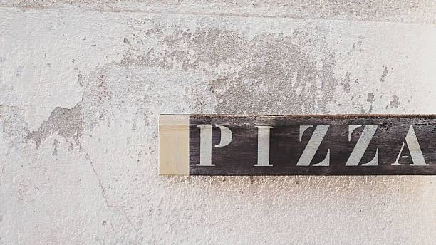 istock Pizza Word Only Sign on an Old Wall Exterior 2229944015
