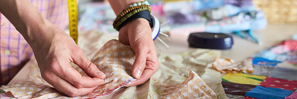 istock Caucasian Young Adult Woman Sewing Fabric Pieces While Working on Patchwork 2229944471