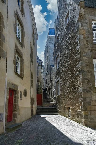 istock Cobblestone alleyway between historic buildings. 2229946377