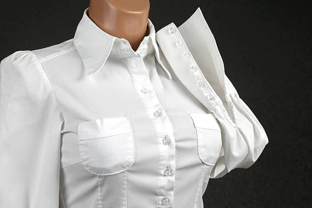 young smiling business woman in white shirt looking left isolated on white background