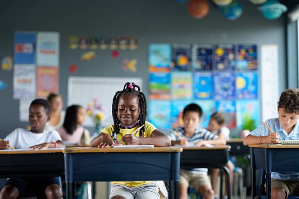 istock Diverse Classroom of Engaged Students Writing in Colorful Learning Environment 2229948838