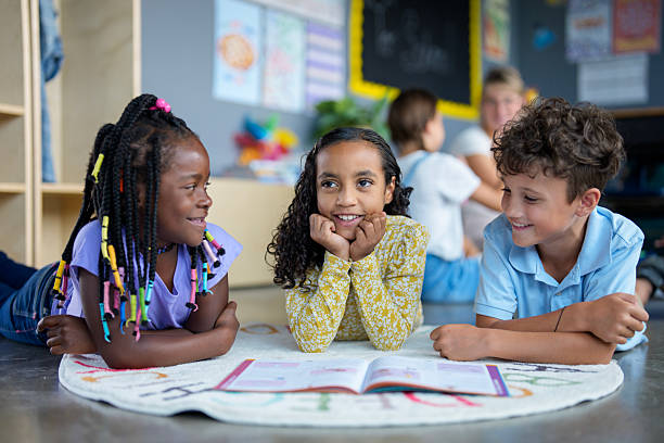 istock Diverse Group of Children Learning and Laughing Together in a Classroom Setting 2229949078