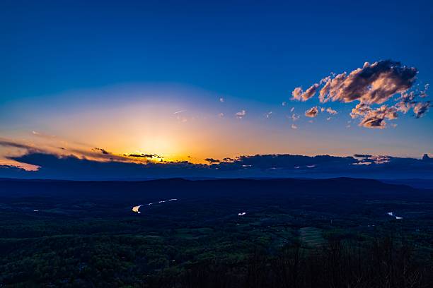 istock Sunset over a vast landscape with blue sky and clouds. 2229950456