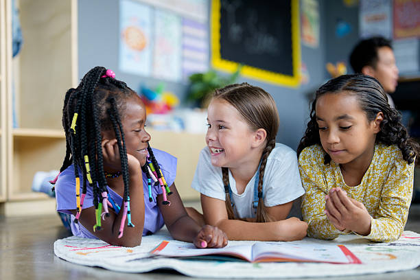 istock Diverse Children Enjoying Group Reading Activity in a Bright Classroom Setting 2229950652