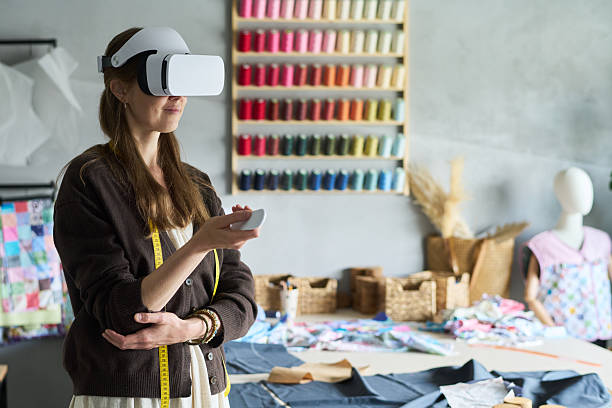 istock Young Adult Caucasian Woman Using Virtual Reality Headset in Creative Studio 2229952724