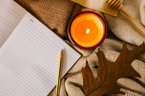 istock Cozy autumn scene with an open lined notebook labeled 