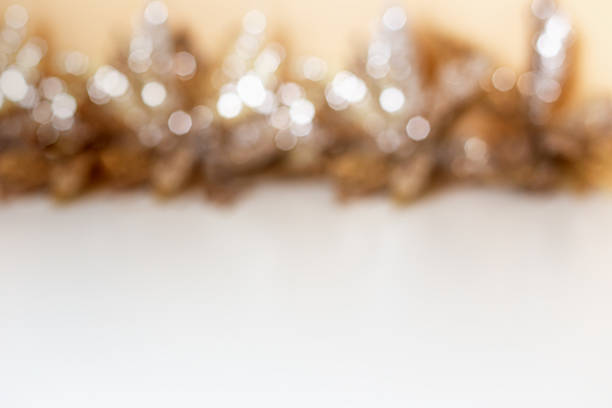 Festive background. Blurred background features sparkling golden decorations that create festive ambiance, with soft focus on foreground providing ample copy space for text or design elements