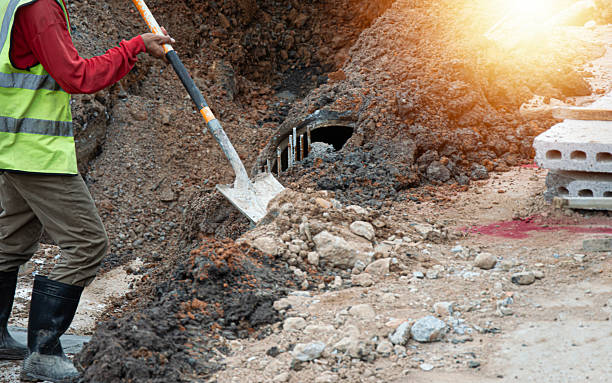 istock Workers are using shovels to scoop sand into the work area before construction. 2229959620