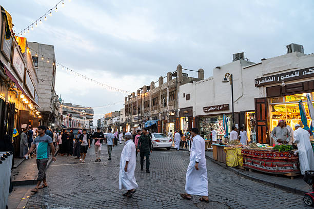 Jeddah, Saudi Arabia - December 20, 2024: At sunset the Qabel Trail in Al Balad district of Jeddah, Saudi Arabia, comes alive. The shops inviting visitors to explore the old city heritage