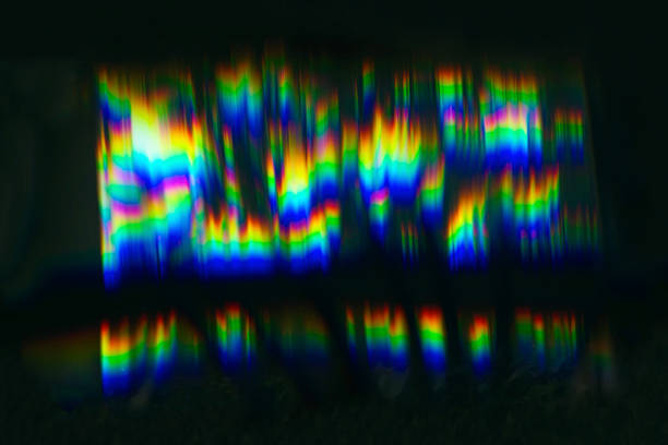 Colorful spectral patterns created by refraction of light through a prism, vibrating patterns. Iridescent lens flare.