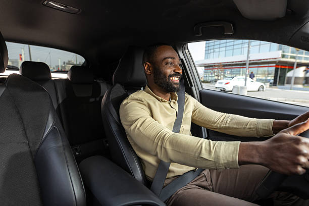istock Smiling young man driving his car 2229973513