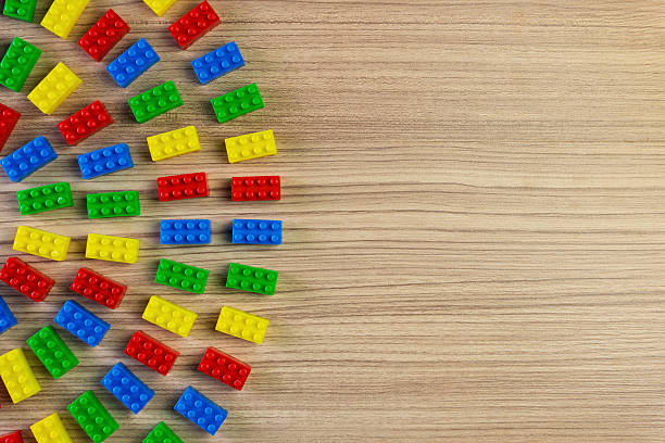 istock Colorful Toy Bricks on Wood Background 2229973768