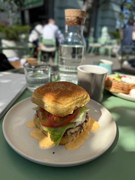 Fresh Gourmet Burger with Lettuce and Tomato on Plate