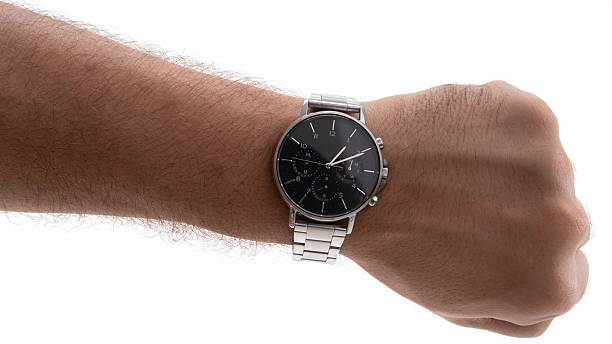 istock Classic silver watch displayed on wrist in a bright setting with focus on the elegant design and craftsmanship during daylight hours 2229981448