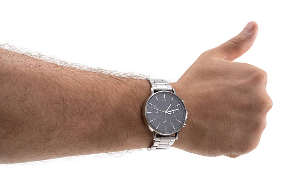 istock Stylish watch showcased on wrist with thumb up gesture in a bright setting 2229981454