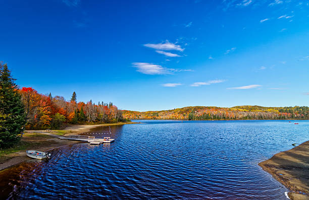 istock Vast opening into the beautiful lake dotted with Fall colors and low hanging clouds. 2229982527