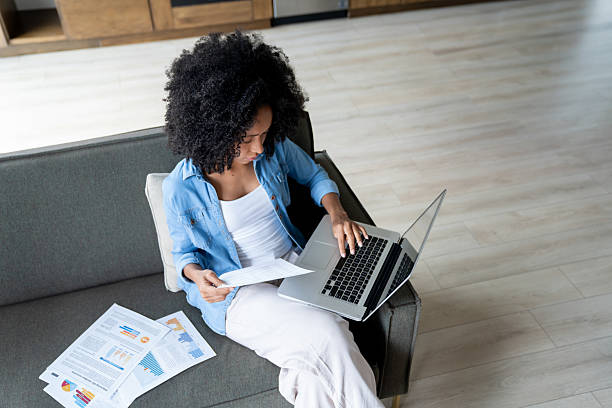 istock Young woman working on her laptop at her home office 2229982685