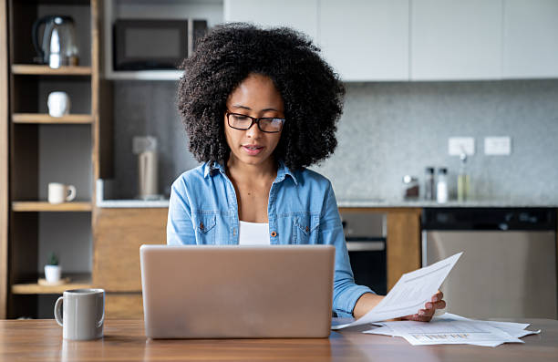 istock Young woman working at home on her laptop 2229982777