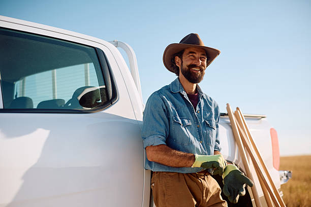 istock Happy farm worker preparing for day working day in the field. 2229985902