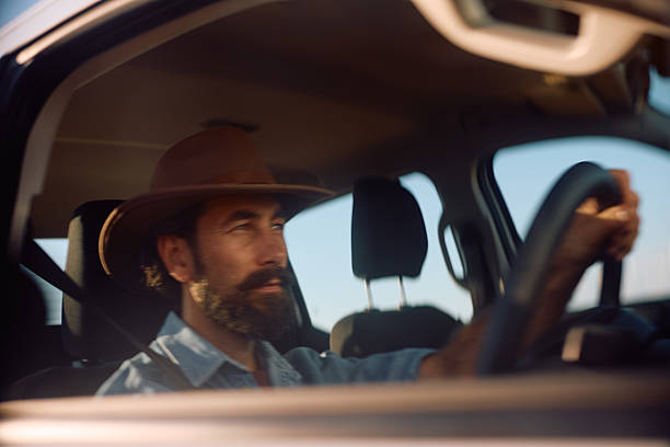 istock Farmer in blurred motion driving pick-up truck. 2229985961