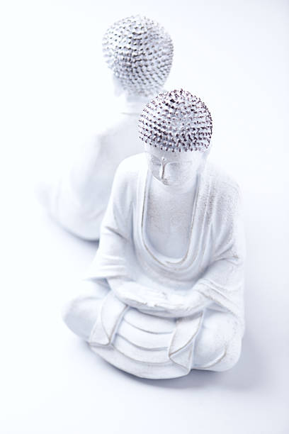 istock Meditating Buddha Statue on bright background. Soft focus. Copy space. 2229986173