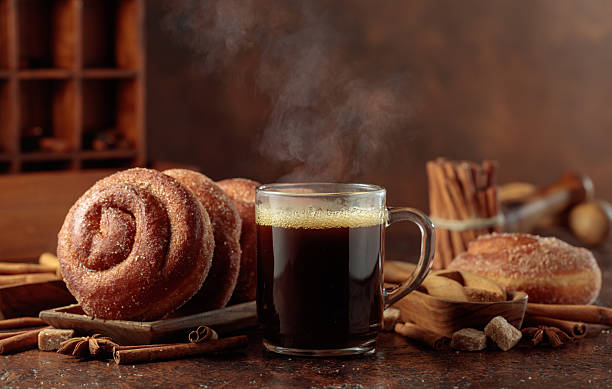 istock Swedish cinnamon rolls and mug of black coffee. 2229986747
