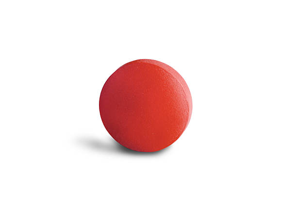 istock One red pill on a white background. Medicinal treatment. 2229987368