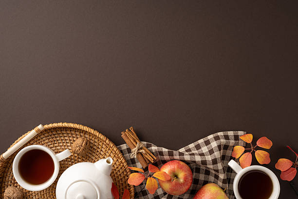 Seasonal themed composition featuring apples, tea, and autumnal elements with a cozy mood