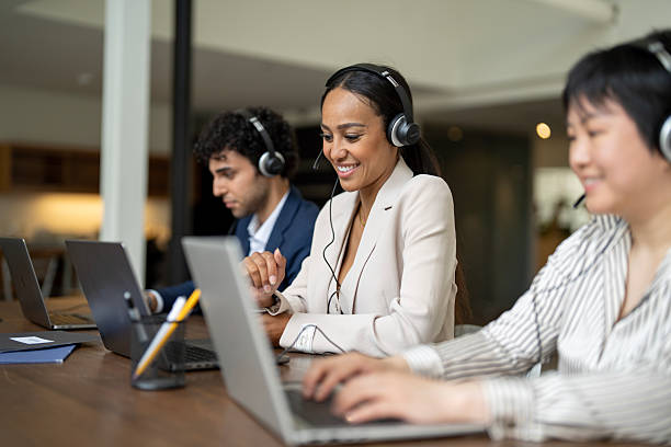 istock Professionally Dressed Team Providing Customer Support in a Modern Office Environment 2229991381