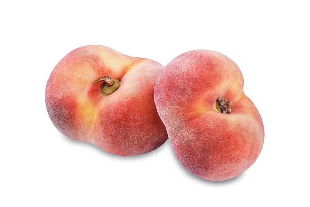 istock Fresh raw peaches on a white isolated background 2229994977