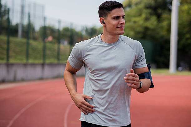 istock Male athlete exercising on track 2229999017