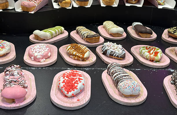 Various decorated doughnuts and pastries, showcasing a delightful assortment of colors, toppings, and glazes.