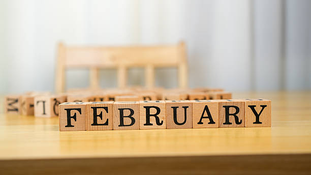 istock February blocks arranged on wooden table create warm and inviting atmosphere, perfect for showcasing month. soft background adds touch of elegance, enhancing overall composition 2230004826