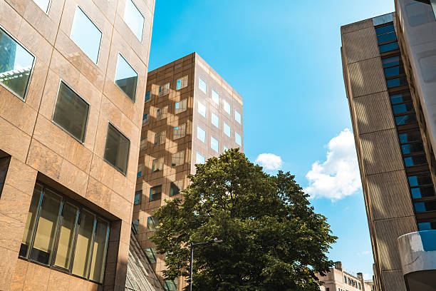 istock Sunlight reflecting on modern buildings in london's financial district 2230014139