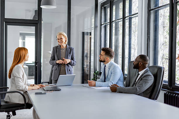 istock Woman explaining concepts during a collaborative business meeting 2230015107