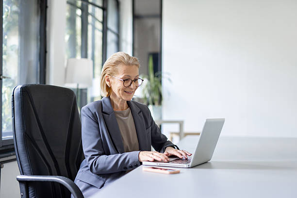 istock Professional Woman Working on Laptop in Modern Office 2230015152