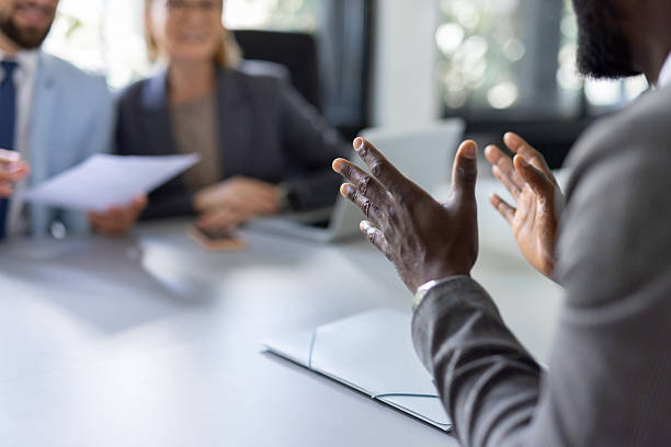 istock Business Discussion with Focused Hands and Engaged Colleagues 2230015153