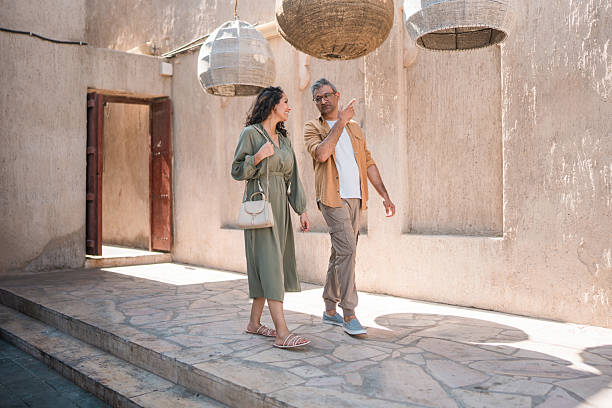 istock Middle Eastern Couple Walking Through Historic Al Fahidi District Under Traditional Lanterns 2230016268