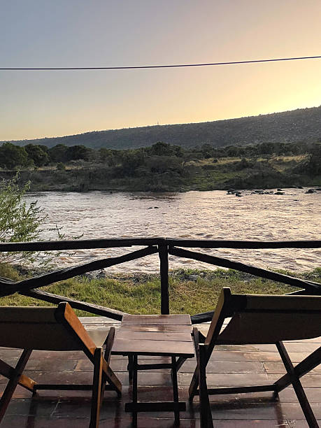 istock Balcony with chairs overlooking river in safari camp 2230017447