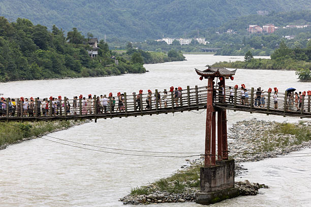 Anlan suspension bridge on the Minjiang river in Dujiangyan, known as one of the Five Ancient Bridges of China. Sichuan Province, Southwest China.
