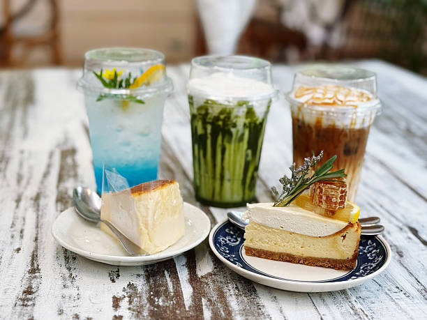 istock Ice coffee with cheesecake on wooden table. Top view, copy space 2230024142
