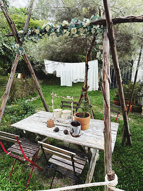 wedding ceremony in the garden with chairs, table and chairs