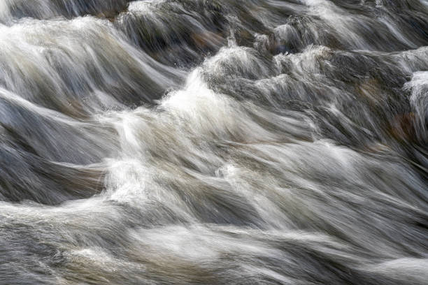 istock Flowing river water in long exposure creating smooth textures, Blaenau Ffestiniog, Gwynedd, Wales, Britain 2230043176