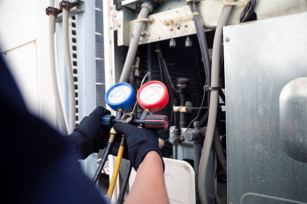 istock Air conditioning, HVAC service technician using gauges to check refrigerant and add refrigerant,Air Conditioning Repair, repairman on the floor fixing air conditioning system. 2230043411