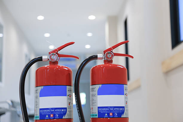 istock Fire extinguisher on hospital wall.Red fire extinguishers available in fire emergencies,safety concept on hospital wall. 2230043471