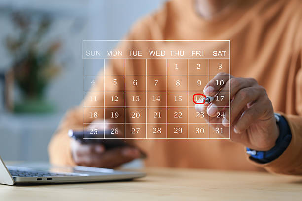 istock Businessman manages time for effective work. Highlight appointment reminders and meeting agenda on the calendar. 2230043476