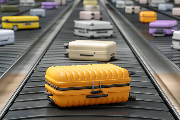 istock Colorful Suitcases on Airport Baggage Carousel 2230047639